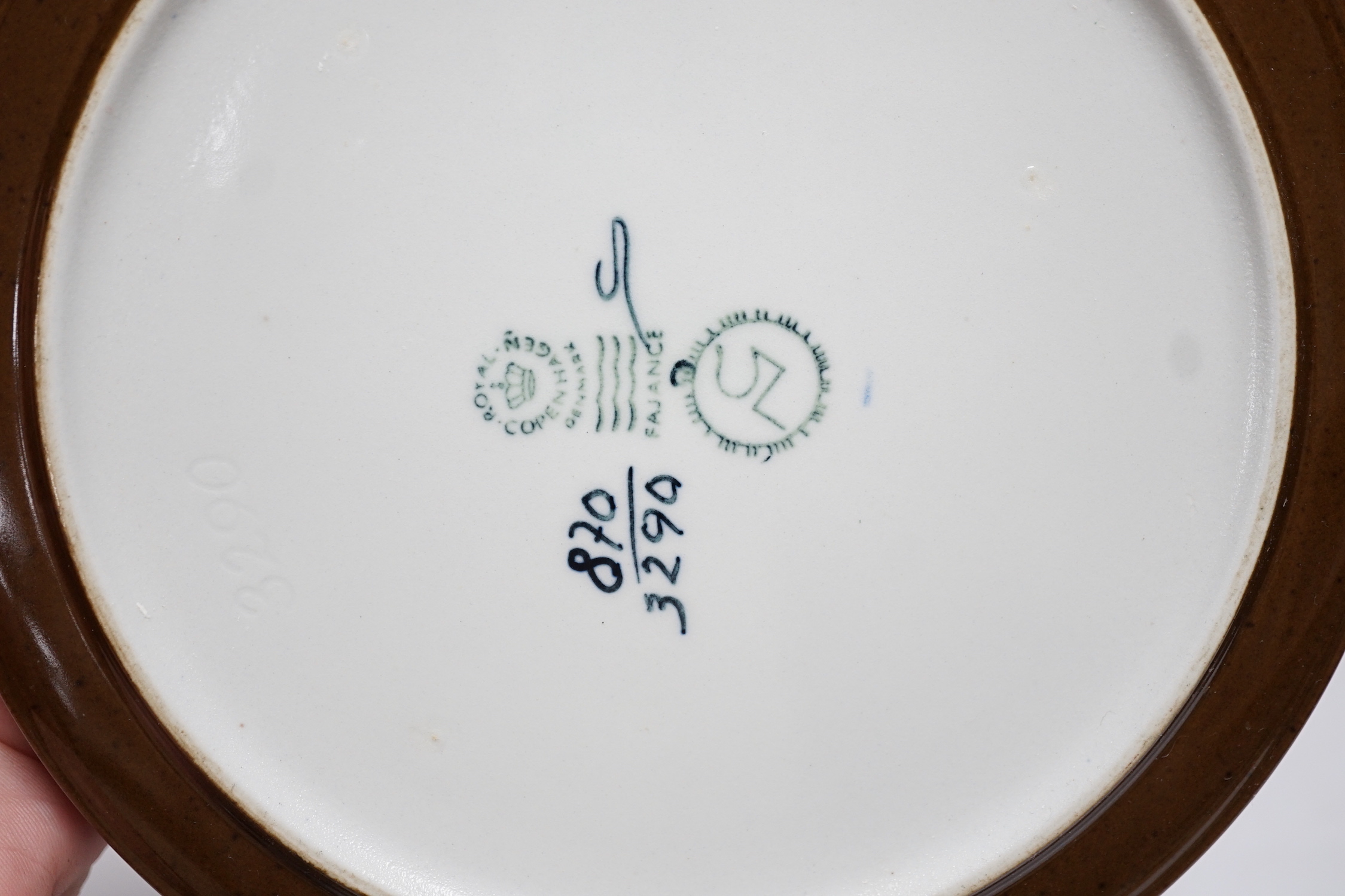 Five Royal Copenhagen fajance items; a lamp, two vases, and two shallow dishes, tallest 29cm